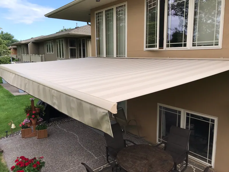 Sunesta retractable awning mounted to a street-facing building frontage in the Kansas City metro